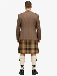 Man wearing a Tan Argyle jacket and plaid kilt on a white background