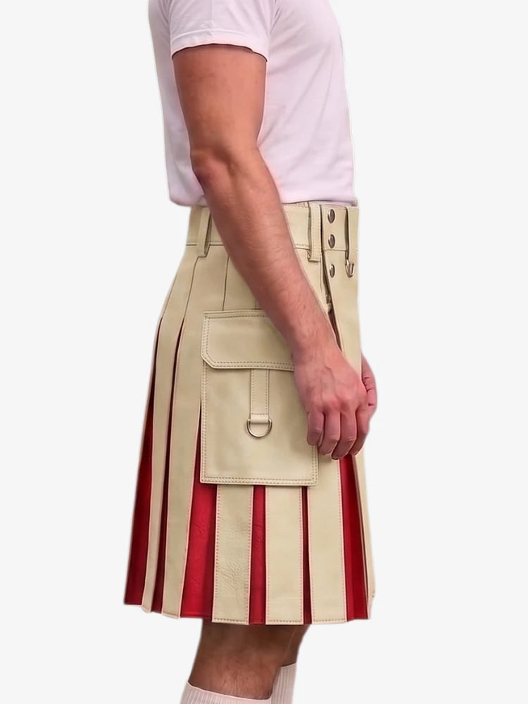 A side view of a model wearing a beige leather kilt with vertical red pleats and a large front flap pocket, paired with a light pink t-shirt against a plain white background.