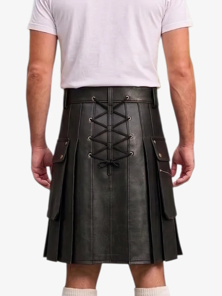 A man wearing a black faux-leather kilt with a lace-up back, side pockets, and pleated front, paired with a white t-shirt and white socks, shown from the back against a white background.