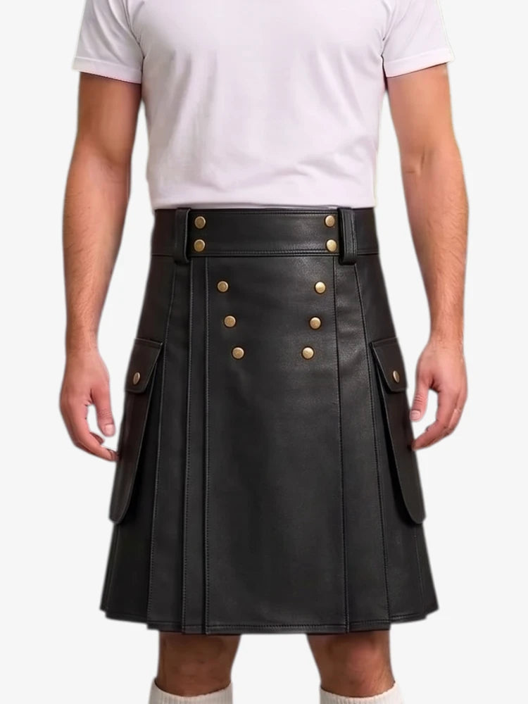 A black faux-leather kilt with gold-tone double-breasted buttons and side flap pockets, shown on a model wearing a white t-shirt against a light gray background.