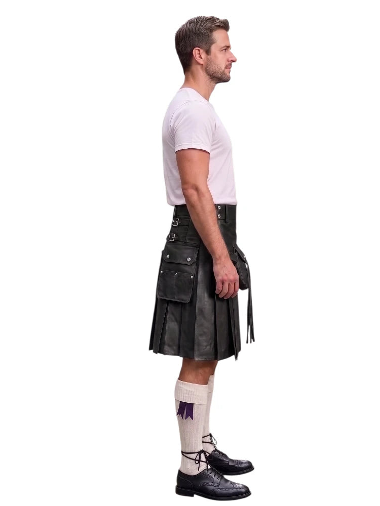 A man shown in profile wearing a black leather kilt, a white t-shirt, white knee-high socks, and black leather shoes, against a solid white background.