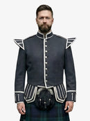 Man wearing a dark grey military-style jacket with white accents on a white background
