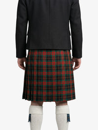Person wearing a black jacket and red plaid kilt on a white background