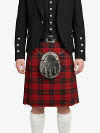 Person wearing a red tartan kilt with a black jacket on a white background