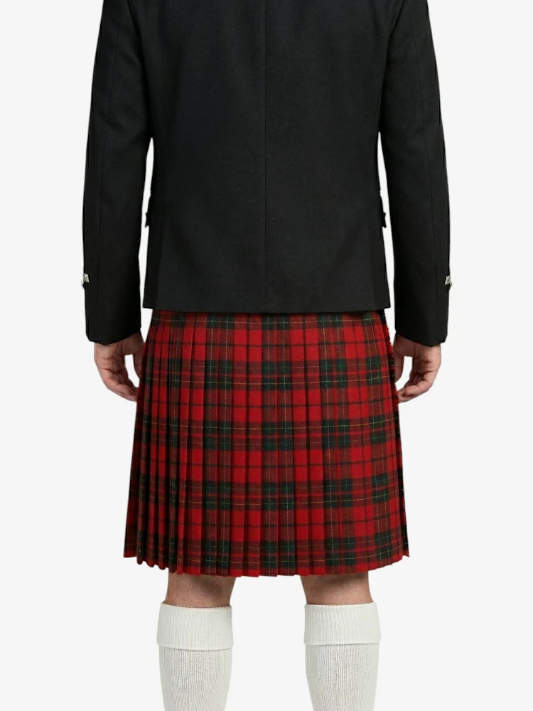 Person wearing a black coat and red plaid kilt on a white background