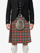 Person wearing a traditional Scottish kilt with a tartan pattern on a white background