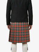 Person wearing a black jacket and red plaid kilt on a white background