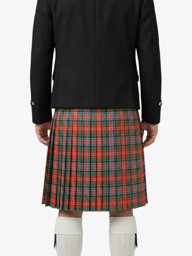 Person wearing a black jacket and red plaid kilt on a white background