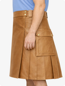 Camel leather skirt worn by a person on a white background