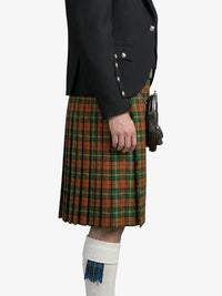 Person wearing a black jacket and plaid kilt on a white background