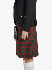 Person wearing a black jacket and red plaid kilt on a white background