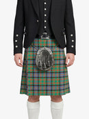 Person wearing a traditional Scottish kilt with a tartan pattern on a white background
