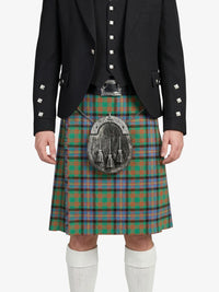 Person wearing a traditional Scottish kilt with a tartan pattern on a white background