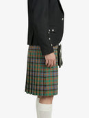 Person wearing a black blazer and green plaid kilt on a white background
