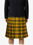 Person wearing a yellow and green plaid kilt with a black top on a white background