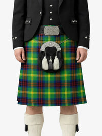 Person wearing a traditional Scottish kilt with a tartan pattern on a white background