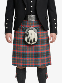 Person wearing a traditional Scottish kilt with a tartan pattern on a white background