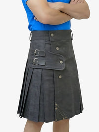 Person wearing a gray kilt with a blue shirt on a white background