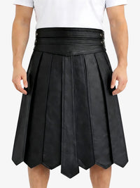 Black pleated skirt worn by a person on a white background