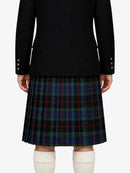 Person wearing a black jacket and plaid kilt on a white background