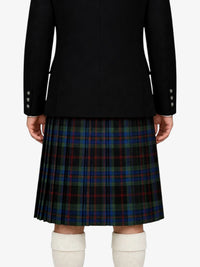 Person wearing a black jacket and plaid kilt on a white background