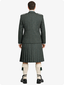 Person wearing a traditional Scottish kilt on a white background