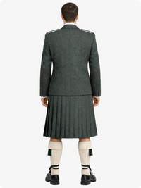 Person wearing a traditional Scottish kilt on a white background