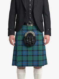 Person wearing a green plaid kilt with a black jacket on a white background