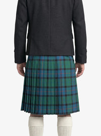 Person wearing a dark coat and green plaid kilt on a white background