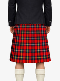 Person wearing a red plaid kilt with a black jacket on a white background