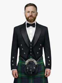 Man wearing a black prince charlie jacket with a gordon tartan kilt on a white background