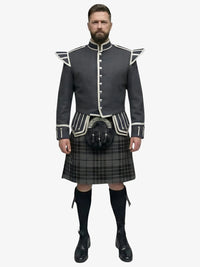 Man wearing a traditional Scottish grey watch tartan kilt with a grey jacket on a white background