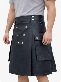 Person wearing a black kilt with silver buttons on a white background