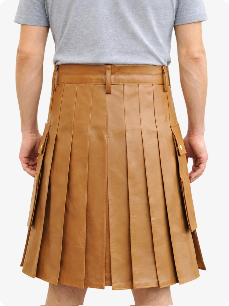 Person wearing a tan pleated skirt on a white background