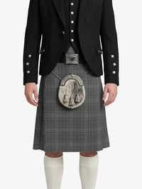 Person wearing a black jacket, gray kilt, and white knee-high socks on a white background