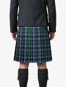 Person wearing a green plaid kilt on a white background