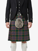 Person wearing a traditional Scottish kilt with a jacket on a white background