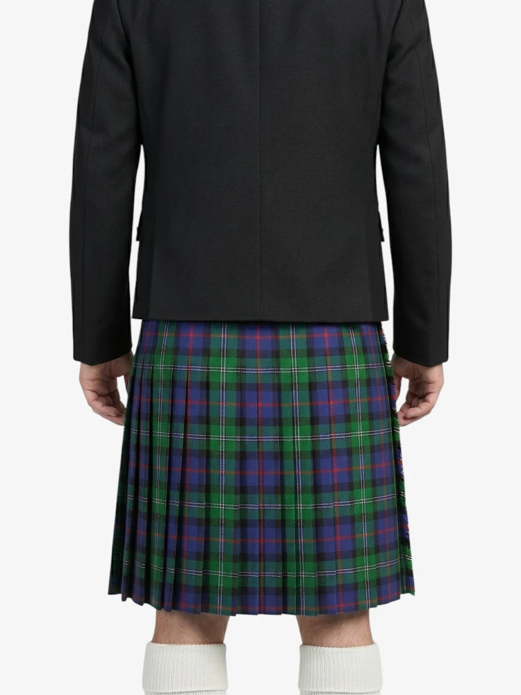 Person wearing a black jacket and a plaid kilt on a white background