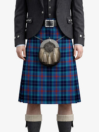 Person wearing a blue plaid kilt with a sporran on a white background