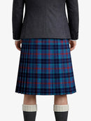 Person wearing a dark gray jacket and blue plaid kilt on a white background