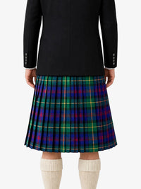 Person wearing a black jacket and plaid skirt on a white background