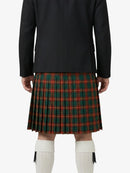 Person wearing a black coat and green plaid kilt on a white background