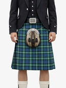 Person wearing a traditional Scottish kilt with a sporran on a white background