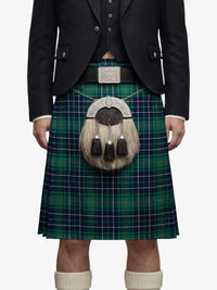 Person wearing a traditional Scottish kilt with a tartan pattern on a white background