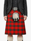 Person wearing a red plaid kilt with a gray jacket and white socks on a white background