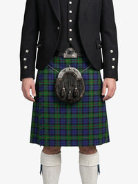 Person wearing a Scottish kilt with a sporran on a white background
