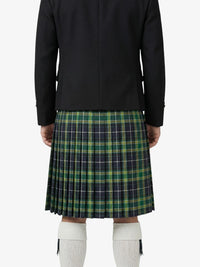Person wearing a black coat and green plaid kilt on a white background
