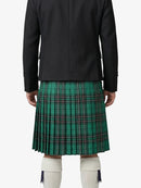 Person wearing a black jacket and green plaid kilt on a white background
