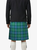 Person wearing a black jacket and green plaid kilt on a white background