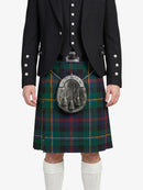 Person wearing a black jacket and tartan kilt with a sporran on a white background